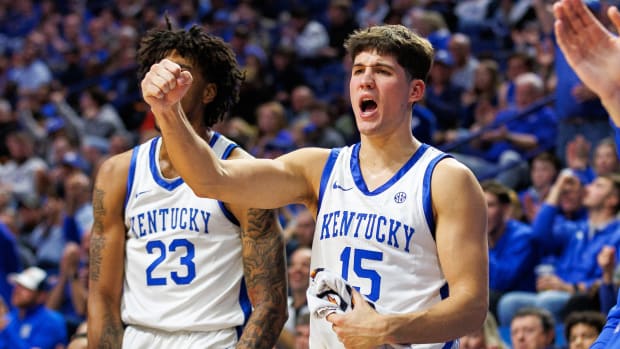 Nov 6, 2023; Lexington, Kentucky, USA; Kentucky Wildcats guard Reed Sheppard (15) celebrates from the bench during the second half against the New Mexico State Aggies at Rupp Arena at Central Bank Center. Mandatory Credit: Jordan Prather-USA TODAY Sports